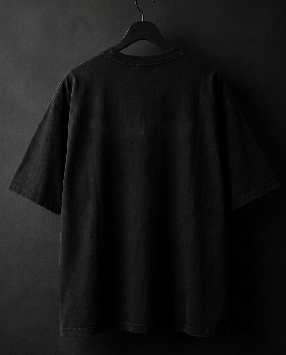 Oversized tee in washed black, back view, printed with maintained eye contact for 3 seconds. need a nap.